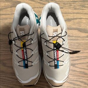 Salomon Beige Trail Sneakers with Black Laces and Teal Accent